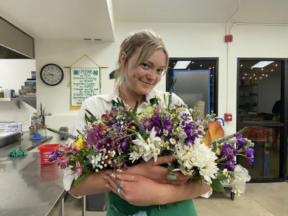 Elsa with a bunch of flowers!