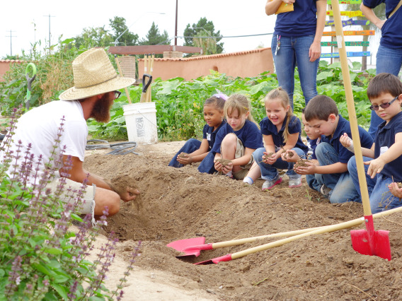 Photo of youth learning in the garden