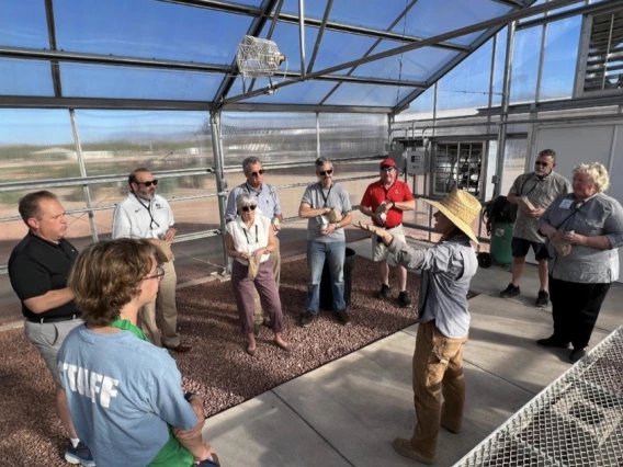 People learning in greenhouse