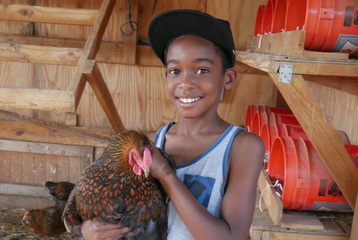 Kid with chicken