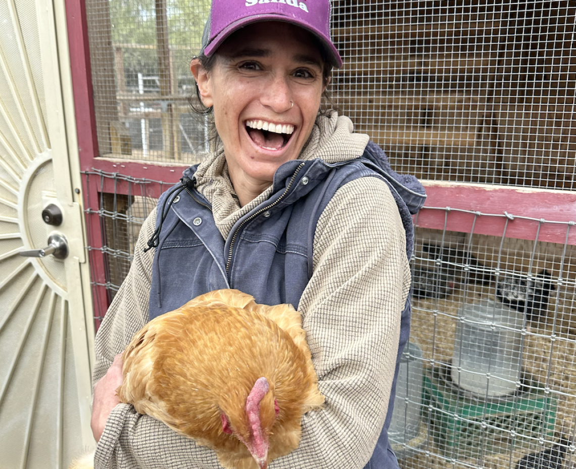 Girl smiling with chicken