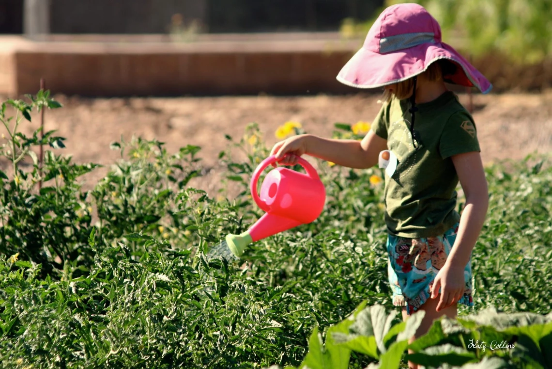 Kid with watering can