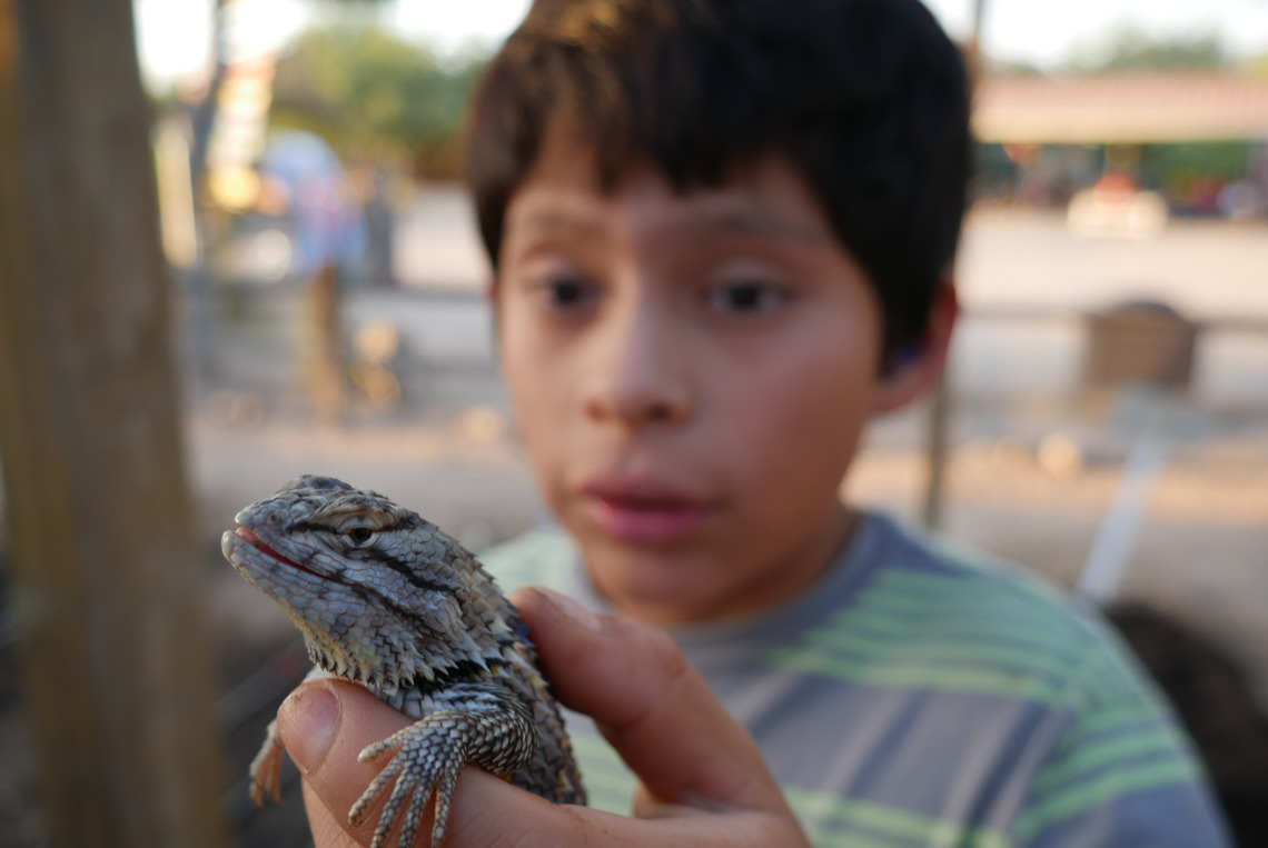 Kid with lizard